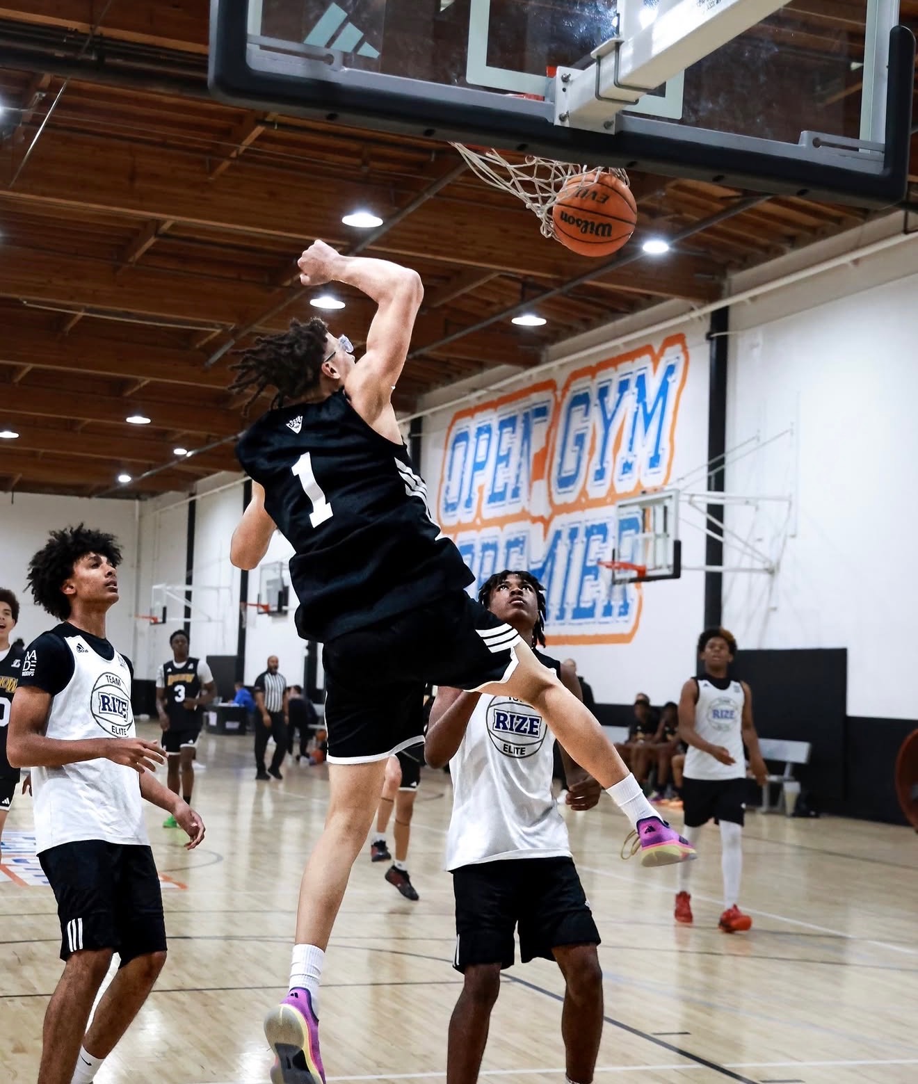 A player throwing down a dunk in a live game
